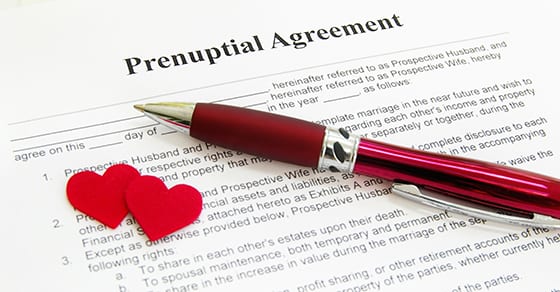 Prenuptial agreement with pen and hearts