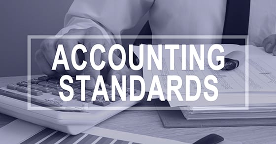 man working on financials and words accounting standards | why cpa designation matters | Dalby Wendland & Co. | CPAs | Business Advisors | Grand Junction CO | Glenwood Springs CO | Montrose CO