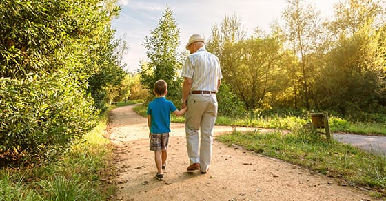 grandfather walking on path with young grandson | about dynasty trusts | estate planning | Dalby Wendland & Co | CPAs | Estate Trust and Gift Tax Planning | Colorado