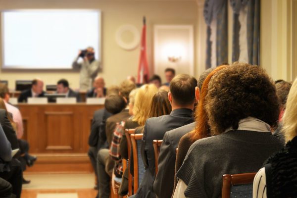 community members attending local government meeting