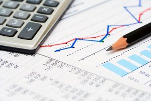 calculator, business financials and growth chart