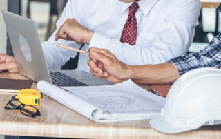 Business men talking | Reviewing their plan on a computer | walking through plans | QIP | OBBBA | DWC CPAs and Advisors | business consulting, tax services, audit and assurance, estate and gift planning, wealth management, bookkeeping, outsourced accounting | Grand Junction CO | Montrose CO | Glenwood Springs CO