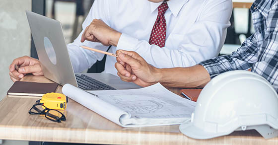 Business men talking | Reviewing their plan on a computer | walking through plans | QIP | OBBBA | DWC CPAs and Advisors | business consulting, tax services, audit and assurance, estate and gift planning, wealth management, bookkeeping, outsourced accounting | Grand Junction CO | Montrose CO | Glenwood Springs CO