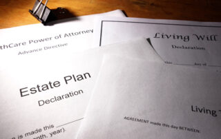 four paper on a brown desk | the first paper is titled Living trust | Second paper is tilted Estate Plan Declaration | The third paper is titled Living Will Declaration | the fourth paper is titled HealthCare Power of Attorney | DWC CPAs and Advisors | business consulting, tax services, audit and assurance, estate and gift planning, wealth management, bookkeeping, outsourced accounting | Grand Junction CO | Montrose CO | Glenwood Springs CO
