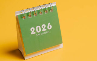 2026 calendar with green cover on yellow background for planning and organization concept.