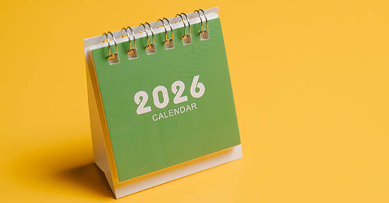 2026 calendar with green cover on yellow background for planning and organization concept.