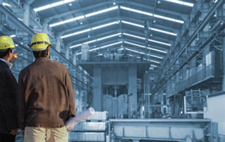 production engineer working in commercial business building with the structural steel structure