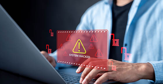System hacked alert warning on laptop screen with red unlocked padlock icons, cyber attack, data breach, computer security threat, and information system.