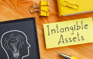 Intangible assets is shown on a business photo using the text
