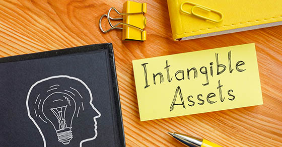 Intangible assets is shown on a business photo using the text